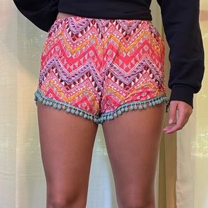 “E2 Clothing” tribal print shorts. Tag says size L, fits like M.